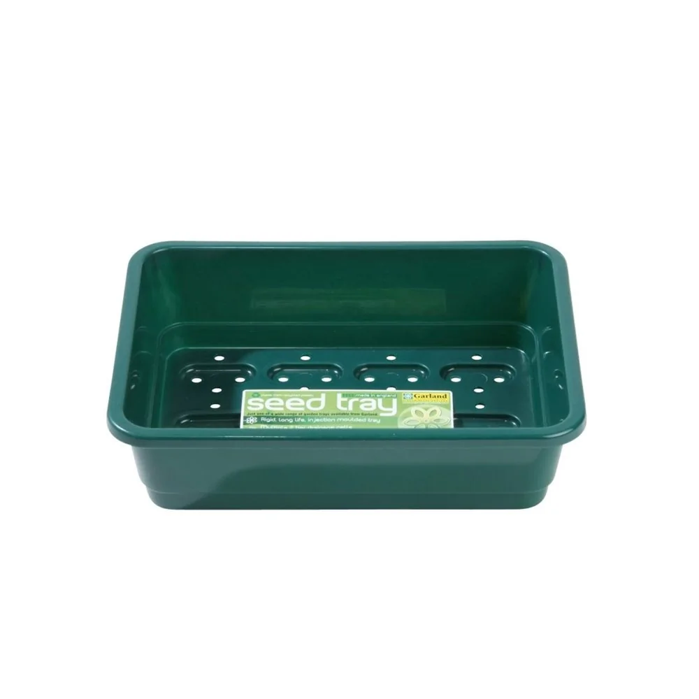 Petit bac à graines vert avec trous