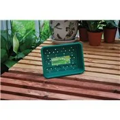 Petit bac à graines vert avec trous